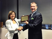 Mark Schnurr receives recognition for completing Dale Carnegie’s course.